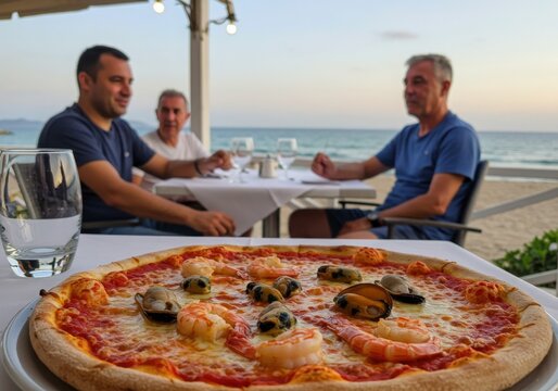 young people with pizza on sea side