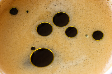 Morning Coffee Infused with Olive Oil for a Healthy, Energizing Start, macro, close up. 