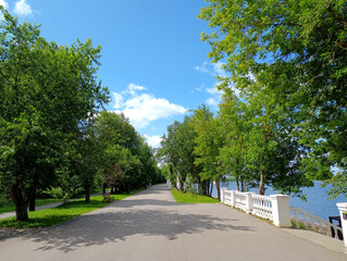Mendeleevskaya embankment on the bank of Volga river on a sunny day in Dubna, Moscow Region, Russia