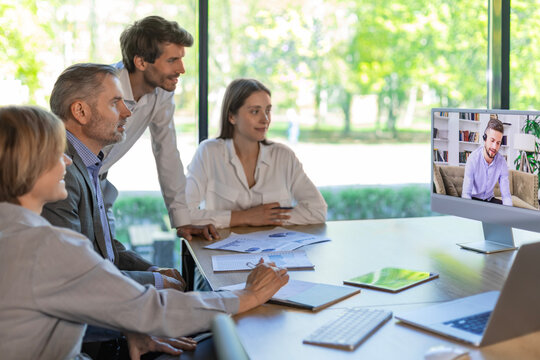 Business people meeting conference discussion corporate concept with colleague in video chart, discussing financial report of their company