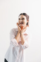 Asian woman rejoicing, looking happy, champion, fist pump gesture, standing over white background....