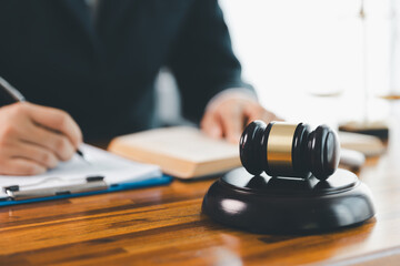 Justice and lawfirm concept. Female lawyer in office with brass scale. Woman hand gavel to bang....