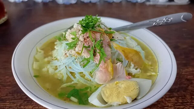 one portion of soto ayam lamongan with rice