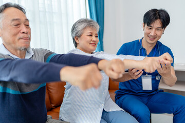 senior woman practices muscle strength exercises arms and hands instruct by physiotherapist. home...
