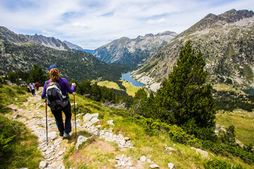 Young hiker woman in Vall de Boi, Aiguestortes and Sant Maurici National Park, Spain