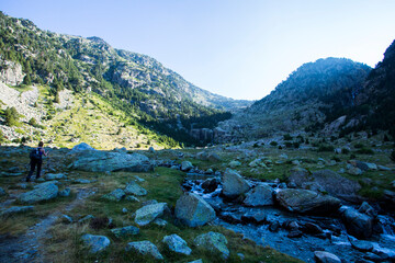 Young hiker woman in Vall de Boi, Aiguestortes and Sant Maurici National Park, Spain