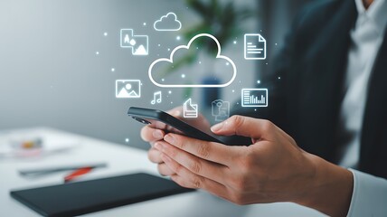 Businessman managing cloud storage with smartphone, demonstrating data management and seamless connectivity for enhanced business efficiency.