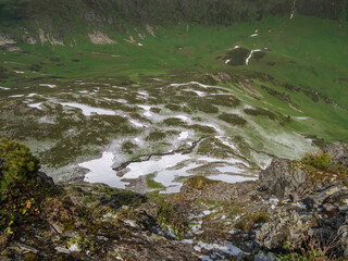 mountain valley with rivers and snow-covered valleys