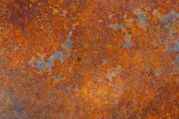 Rusty flat metal texture in industrial outdoor setting during daytime