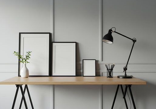 Modern home office desk with blank picture frames a plant in a vase and an adjustable desk lamp - Powered by Adobe