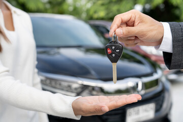 lease, rental car, sell, buy. Dealership manager send car keys to the new owner.  Sales, loan credit financial, rent vehicle, insurance,  renting, Seller, dealer, installment, car care business