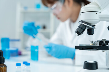 Scientist analyze biochemical samples in advanced scientific laboratory. Medical professional use...