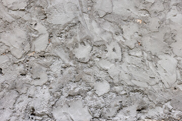 Rough textured concrete wall under daylight outdoors