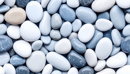 A natural wallpaper featuring an overhead view of multicolored river pebbles resting along the edge of a peaceful stream, with soft ripples and gentle sunlight adding a tranquil, organic feel.