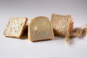 Different types of bread and wheat ears