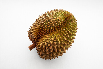 Close-up of a whole durian fruit on a white background