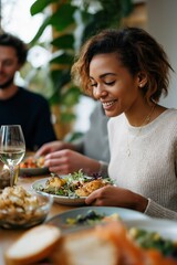Young african female enjoying meal with friends at dining table