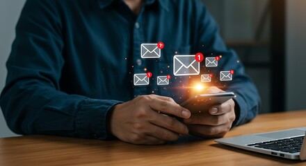 A person holds a glowing red warning triangle with an exclamation mark in their outstretched hand symbolizing danger alerts and digital threats