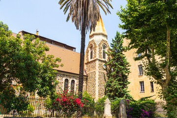 Old church with bell tower and palm tree France, Corsica, Ajaccio, 13 June 2025