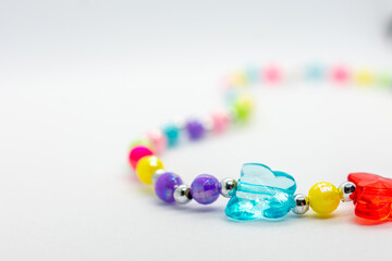 Colorful necklace with butterflies and beads. The necklace is made of glass and is very colorful.