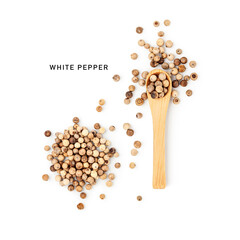 White peppercorns in wooden spoon and heap photography isolated on white background
