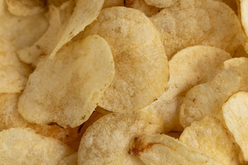 Crispy potato chips arranged in a bowl, ready for snacking at a casual gathering during the...