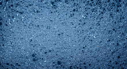 Obraz premium Detailed close up showcases the intricate structure of foam with a blue tint, creating an interesting abstract design.