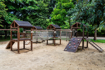 Rope bridge and climb ramp in summer camp playground