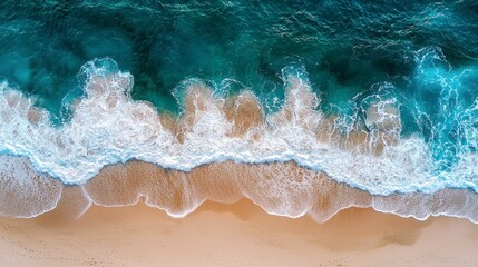 Fototapeta premium Aerial View of Turquoise Ocean Waves Gently Crashing on Soft Sandy Beach in Vibrant Lifestyle Setting