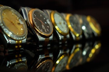 Luxury watches placed on a glittering