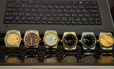 Luxury watches placed on a glittering