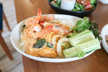 creamy omelet or omelet or omelette or fried egg with shrimp and squid or seafood omelette and rice