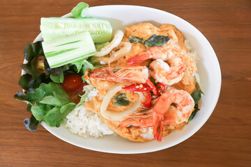 creamy omelet or omelet or omelette or fried egg with shrimp and squid or seafood omelette and rice