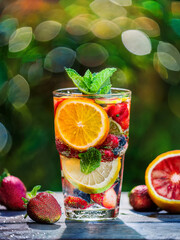 Grid of fruit-infused water glasses with citrus and berry combinations in refreshing beverage theme
