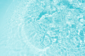 Blue water with ripples on the surface. Defocus blurred transparent blue colored clear calm water...
