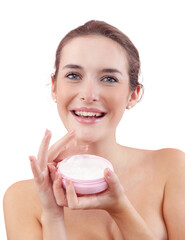 Smiling young woman with makeup holding an open plastic jar of face cream near her face. Skincare...