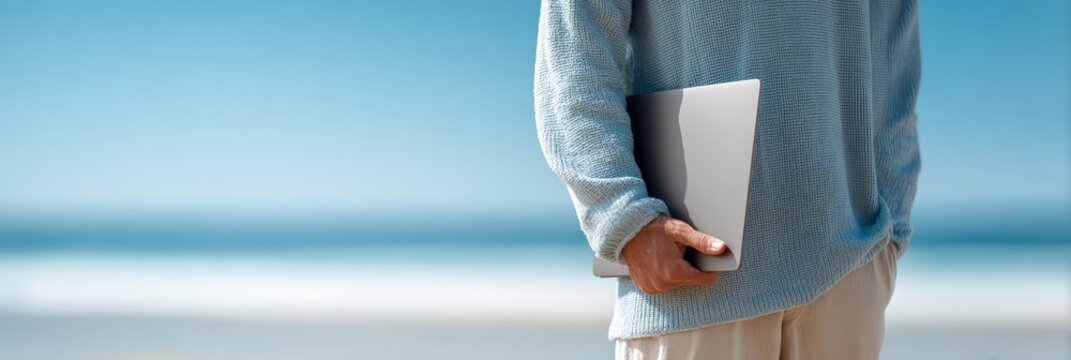 Freelancer enjoying the freedom of working by the sea, blending work and leisure in a stunning natural setting, embodying the perfect work and travel lifestyle