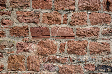 abstract background of an old shabby red brick wall close up