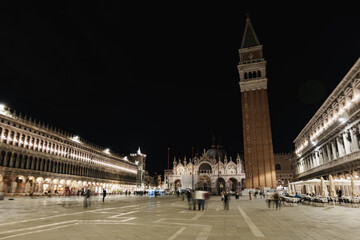Nighttime enchantment at San Marco plaza with flickering lights and shadows
