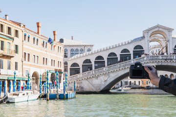 Capturing the essence of Venice at the iconic Rialto Bridge during daylight