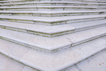 Steps of aged stone invite exploration in serene architectural setting