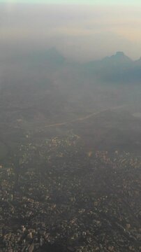 Ulhas river, Mumbai, India. Badlapur is a city in Thane district, Maharashtra state, India, and is a part of Mumbai Metropolitan Region. Aerial View From Airplane Window On View of the Mumbai suburb