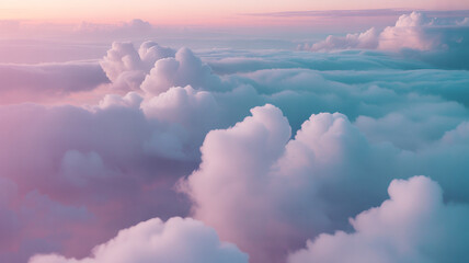 Clouds painted in soft pastels fill the sky during sunset, creating a serene and tranquil atmosphere