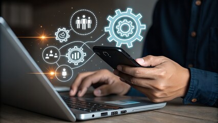Person using a smartphone and laptop with digital network and business icons