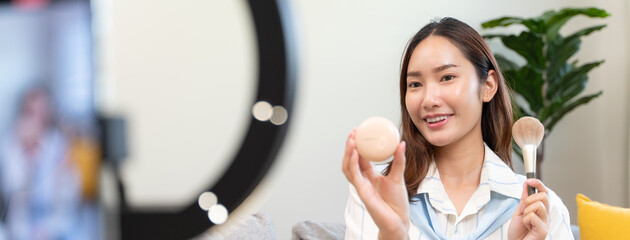 Social media influencer and marketing advertise concept, Asian young female broadcasting lives in...