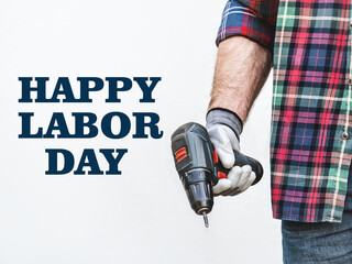 Happy Labor Day. Attractive man and adjustable wrench. Closeup, studio shot. Congratulations for...