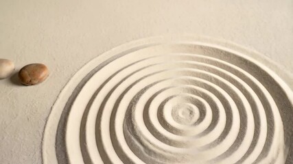 Zen garden with white sand creating circular patterns and two stones for relaxation and meditation in a peaceful environment - Powered by Adobe