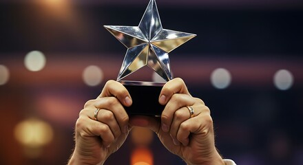 Hands Holding Up a Silver Star Trophy