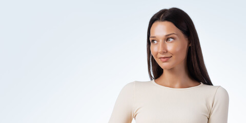 Sport Woman With Glowing Skin Looking Away In Cream Outfit Studio Portrait
