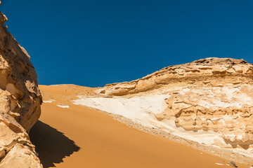 White rock formations and sand dunes in Egypt's White Desert, natural desert landscape	
